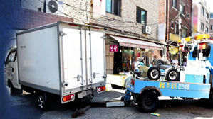 '화난다고' 상가 주차장 입구 막은 트럭…구청이 견인