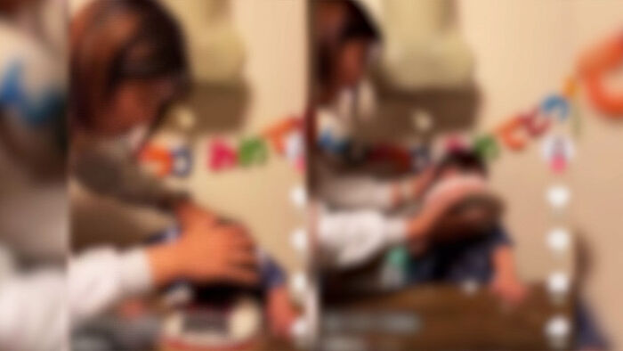 Controversy Erupts Over Video of Child's Face Being Forced Into Cake
