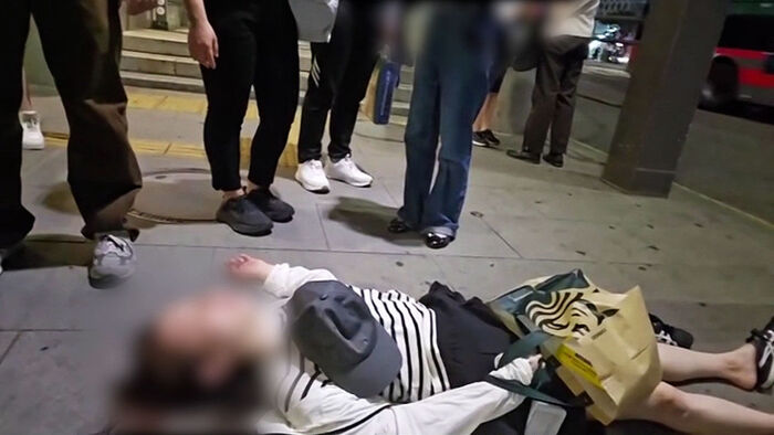 Woman Collapses in Middle of Street… Suddenly Acts with Vacant Eyes