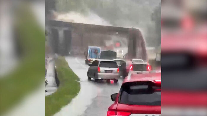 Muddy Water Cascades Onto Road in Terrifying Scene