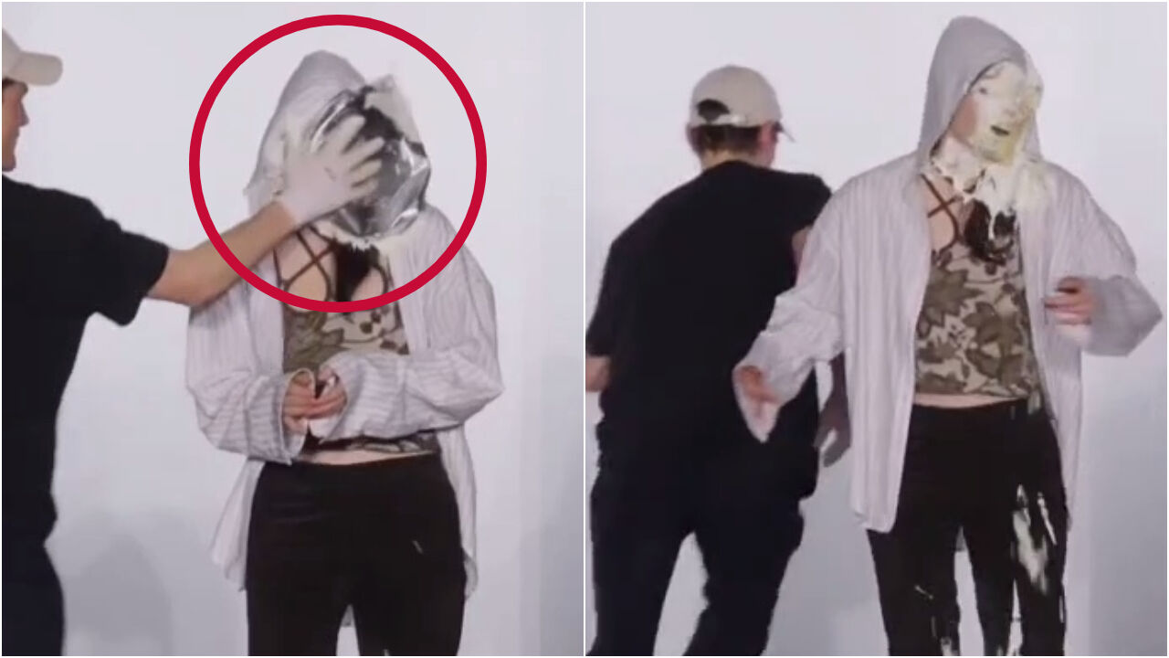 디자이너 칼손이 무대 인사 중 관객에게 케이크 테러를 당한 모습. 