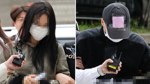 축구 국가대표팀 주장 손흥민의 아이를 임신했다고 주장하며 돈을 뜯어내려 한 20대 여성 양 모 씨(왼쪽)와 40대 남성 용 모 씨가 17일 영장실질심사를 받기 위해 서울중앙지법에 들어서고 있다.