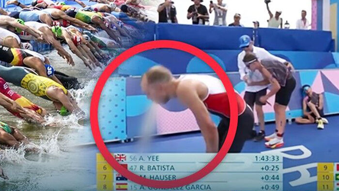 Canada's Tyler Mislawchuk vomits immediately after crossing the finish line of the men's triathlon at the 2024 Paris Olympics.