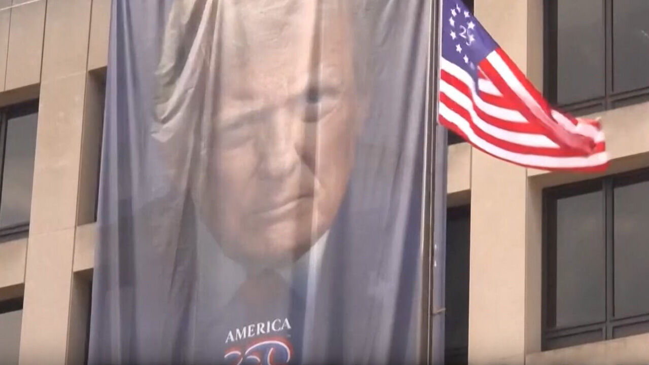 A photo of Trump hanging at the National Mall in commemoration of the 250th anniversary of the founding of the nation