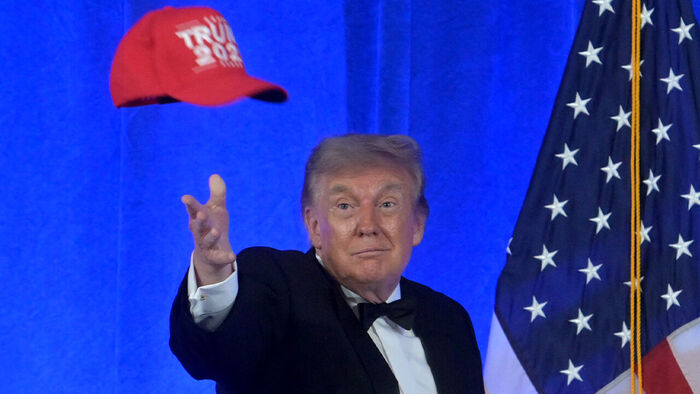President Trump pulling out a 'Trump 2028' hat
