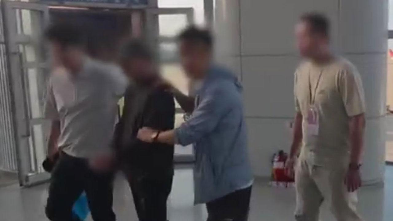 A is being handed over to Chinese investigative authorities at Incheon International Airport.