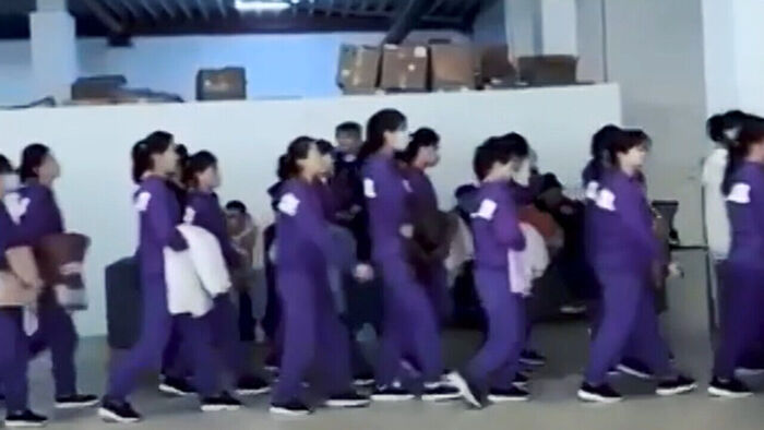 North Korean women heading to work at a logistics warehouse of a major e-commerce company known as the Russian version of Coupang
