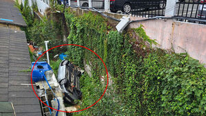 Car Falls 3 Meters From Apartment Parking Lot... Driver in 80s Hospitalized