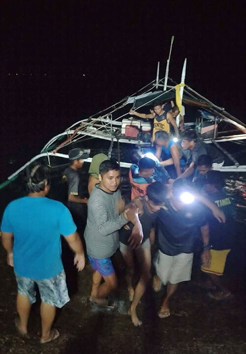 Passengers rescued by fishermen after a ferry fire in the Philippines