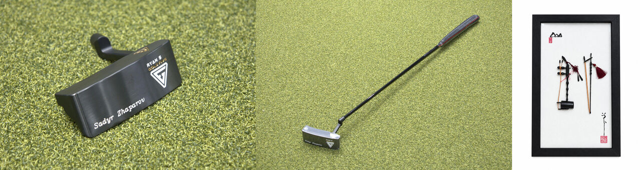 President Lee gifts a golf putter to Kyrgyz president (Photo courtesy of Cheong Wa Dae, Yonhap News)