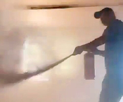 Employer spraying a fire extinguisher (Photo provided by Gwangju-Jeonnam Migrant Workers Human Rights Network, Yonhap News)