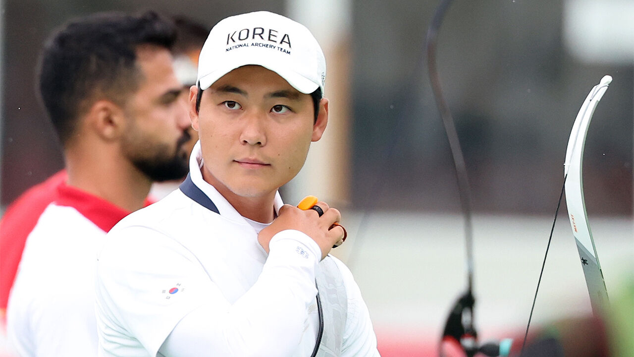 South Korea's Lee Woo-seok competes against Iran's Reza Shabani in the men's recurve individual round of 16 at the 2026 Aichi-Nagoya Asian Games held at the multipurpose plaza of Okazaki Chuo Park in Aichi Prefecture, Japan, on September 29. Lee Woo-seok is focusing.