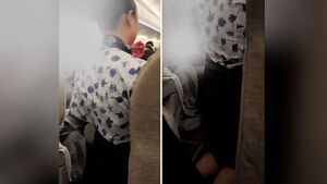 Flight Attendant Filmed Kneeling After Waking Passenger Sparks Outrage