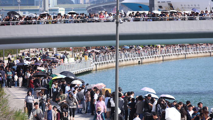 Citizens and tourists gather to see the shark 'Bukangi' staying in the waterway at Bukhang Waterfront Park in Dong-gu, Busan, on October 4.