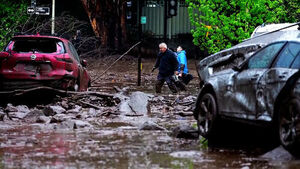 Cars Swept Away as Muddy Waters Hit Downtown... Over 1,000 Rescued