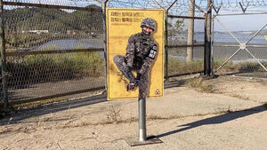 One-Legged Soldier Clinging to Ankle: The Identity of the Surprise Ad in Front of Barbed Wire