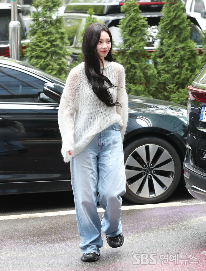 Karina keeps it light and springy on her way into the studio.