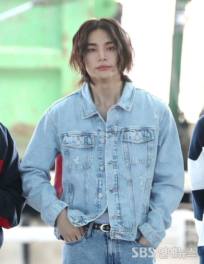 Hyunjin of Stray Kids at Incheon International Airport, wearing a denim jacket