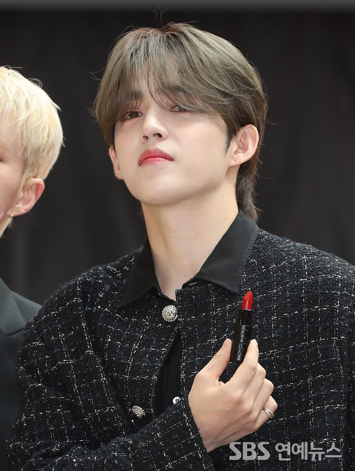 SEVENTEEN’s S.Coups applies lipstick at a cosmetics brand photo call in Seoul