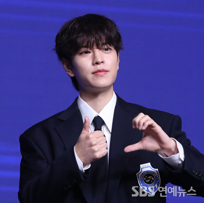 Stray Kids' SEUNGMIN Flashes a Heart at 'KARMA' Press Conference in Seoul