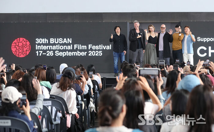 Milla Jovovich, Paul W.S. Anderson and Director Adrian Grunberg at The Protector Photo Call in Busan
