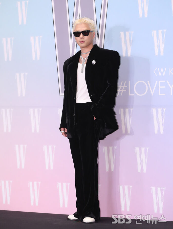 Taeyang poses at the Four Seasons Hotel Seoul for a breast cancer awareness campaign