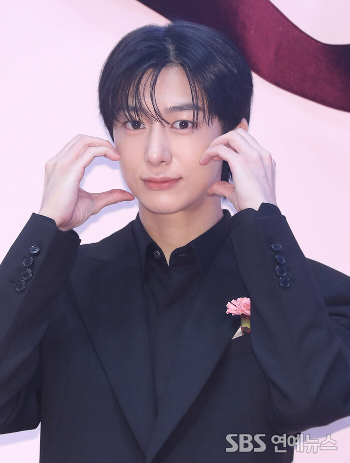 HYUNGWON of MONSTA X Melts the Winter Chill With a Cheek-Heart Pose