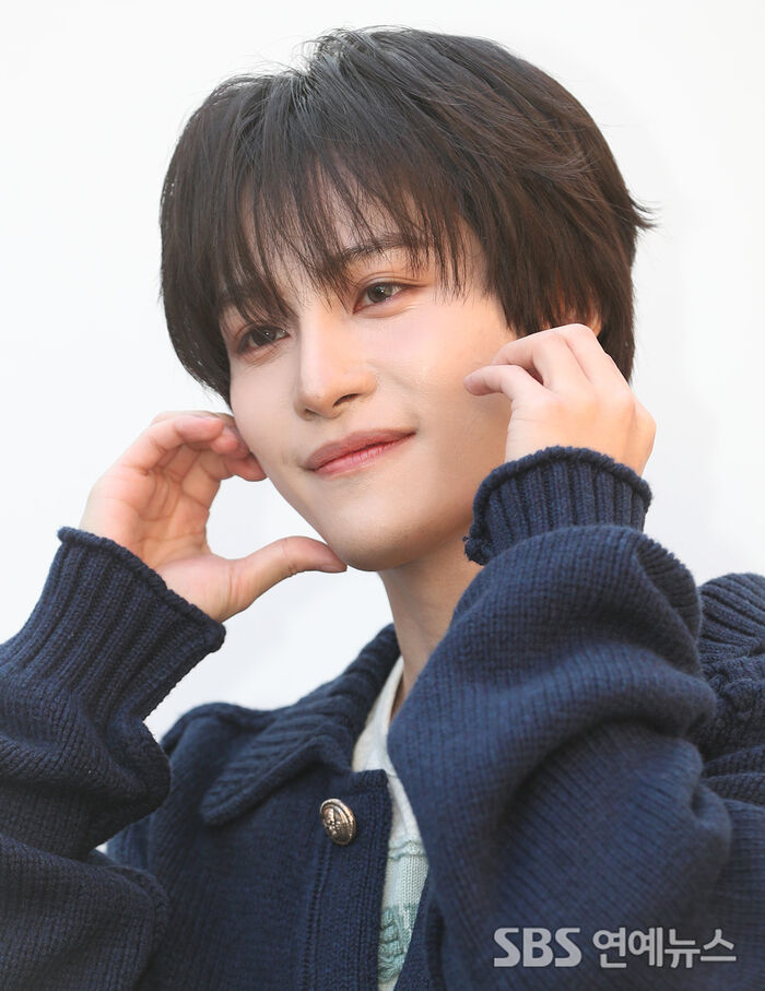 NCT’s YangYang Melts the Winter Chill With a Cheek-Heart Pose