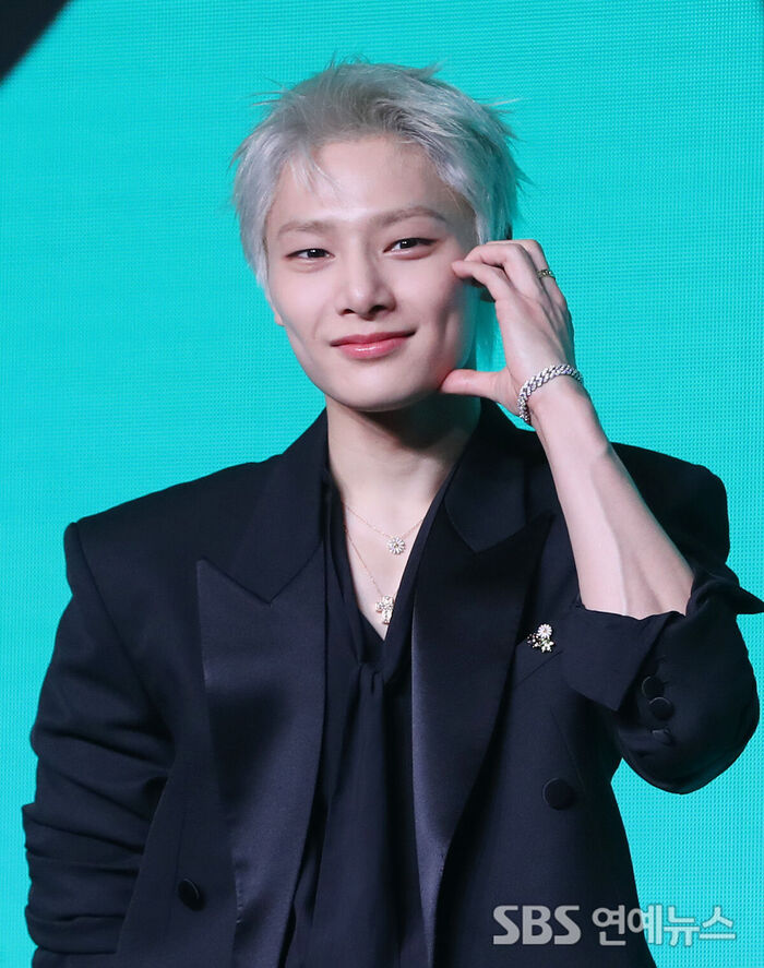 Stray Kids' I.N Flashes a Bright Smile Behind a Heart Pose