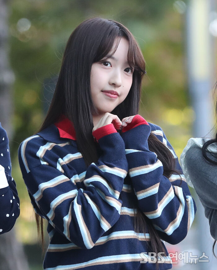 A2O LITE's XILI Strikes a Heart Pose on Her Way to Radio Recording